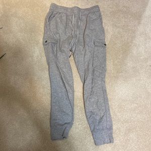 This is a pair of grey cargo joggers.